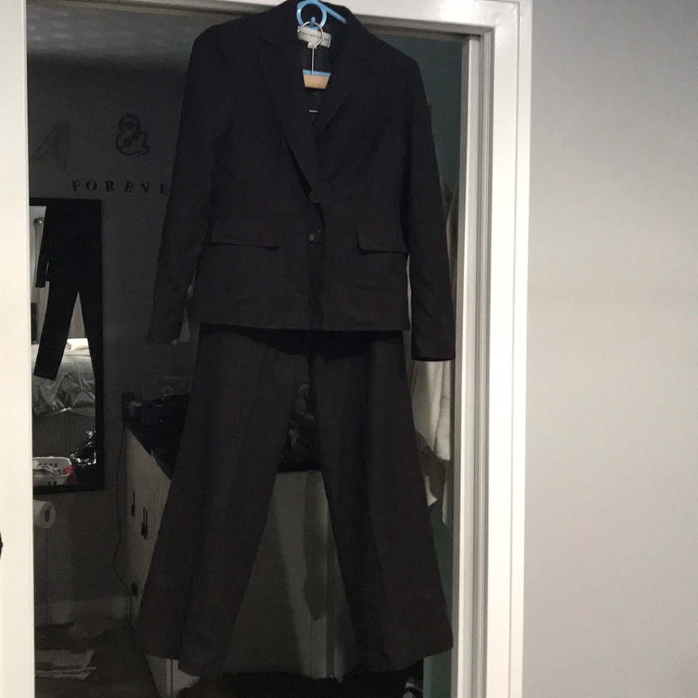 Gorgeous black suit with light blue and maroon.